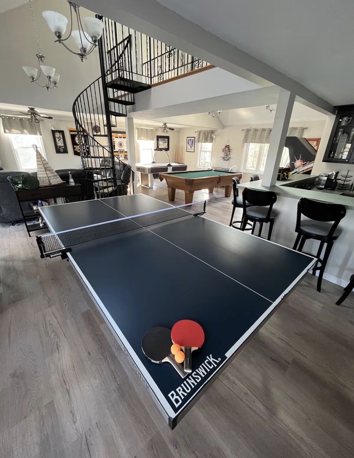 Lake house game room with ping pong and pool table