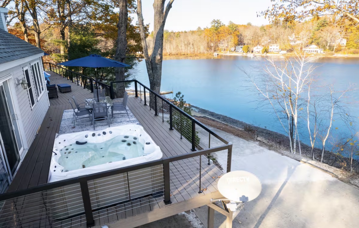 Hot tub on the lake house deck overlooking the water